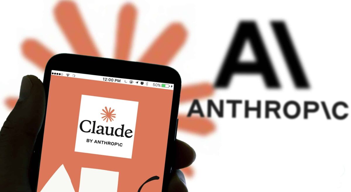 A smartphone displays the logo of Claude by Anthropic against a background featuring the Anthropic logo with a stylized flower and the text "AI ANTHROPIC" in fr