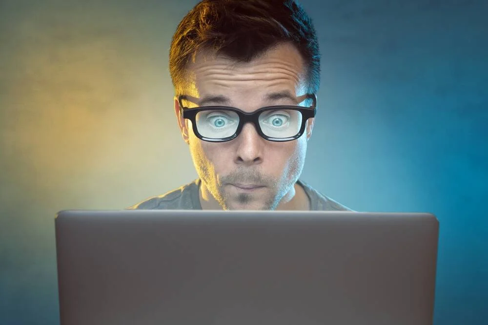 A government building exterior in muted afternoon light, the kind of department that signs ten-year shared-service contracts.