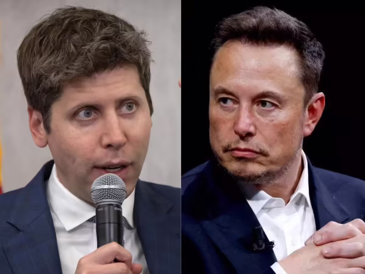 A man with brown hair and a suit is speaking into a microphone on the left, while another man with dark hair and a serious expression, also dressed in a suit, i
