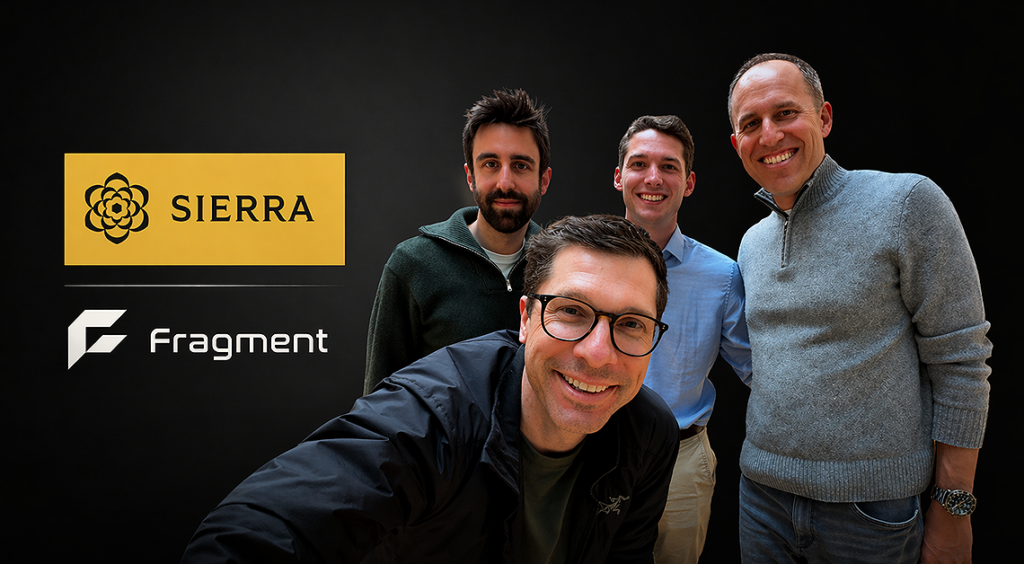 The Sierra and Fragment founders posing together with both company logos in the background, after announcing the acquisition
